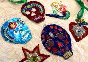 painted tin decorations in the shap of skulls, hearts, stars etc.