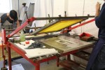 Screen printing using vacuum beds during a course