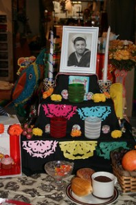 Shrine with photo of a man and paper cut banners