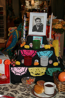 Shrine with photo of a man and paper cut banners