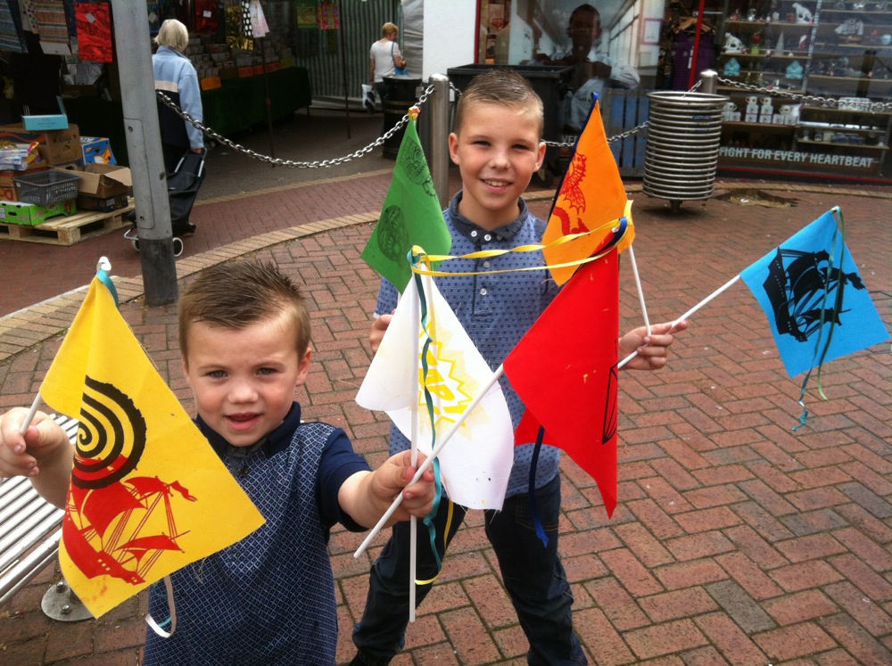 Two boys with flags they have printed