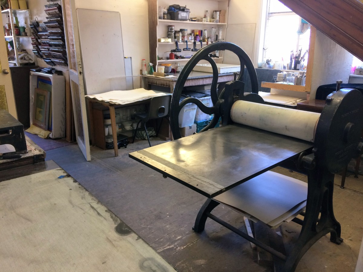 Large etching press in a print room